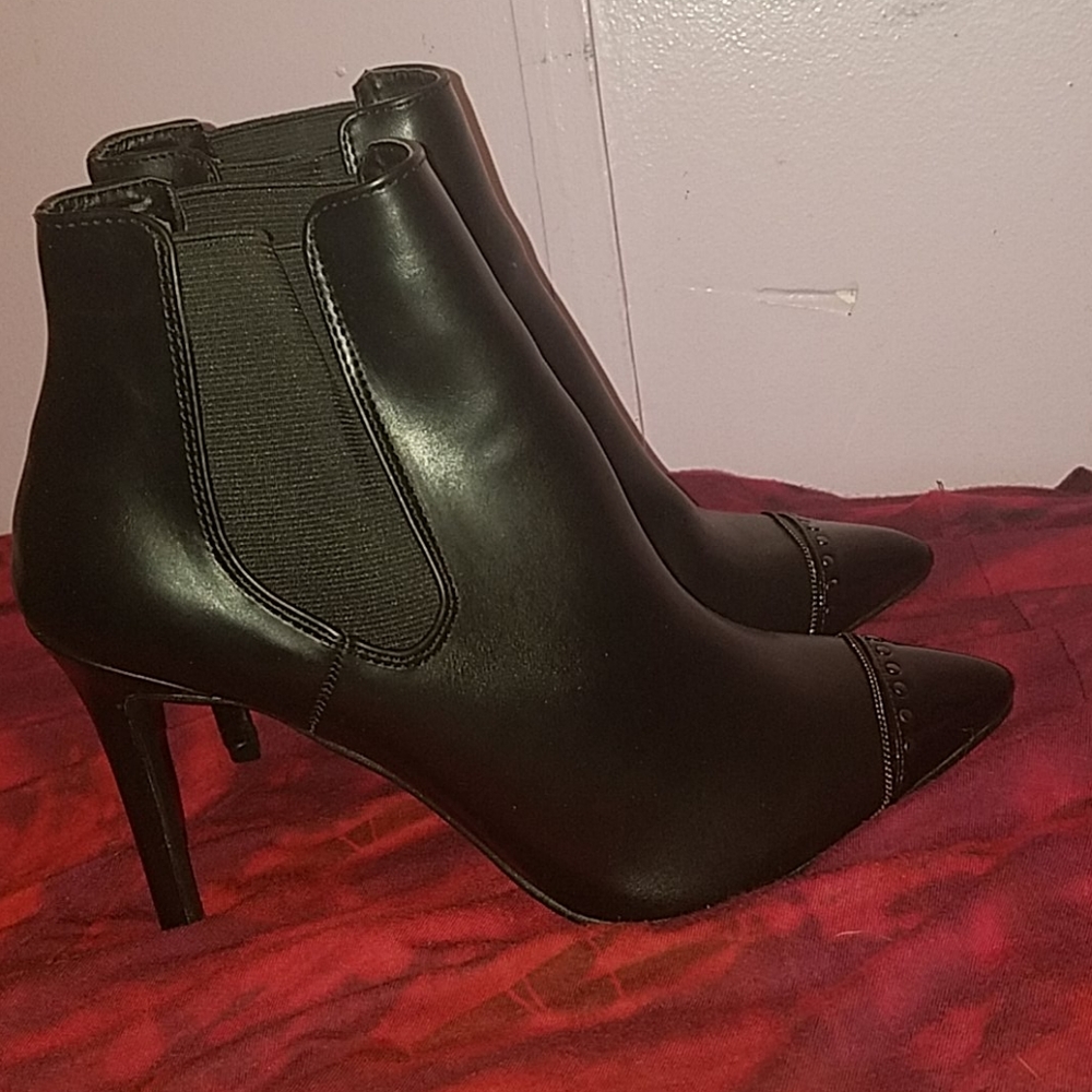 Size 9 Versace high heel boots.